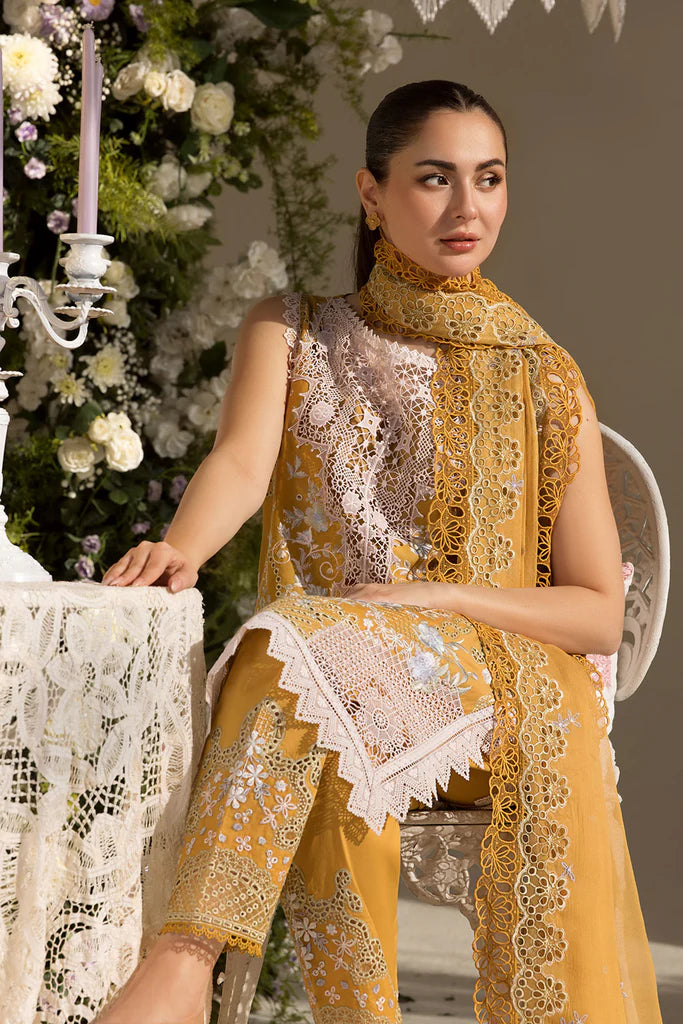 Model wearing Sobia Nazir Design 6B mustard yellow luxury lawn dress with intricate embroidery. Shop Pakistani clothes online in the UK for casual and festive wear.
