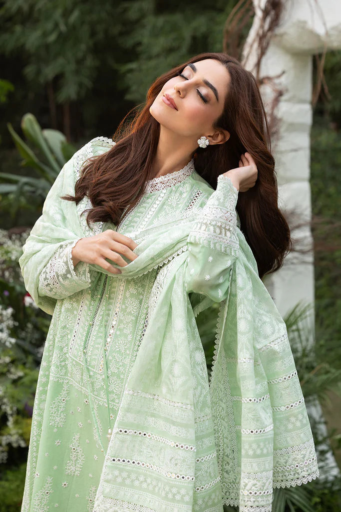 Model wearing Sobia Nazir Design 7B pastel green luxury lawn dress with delicate embroidery. Shop Pakistani clothes online in the UK for casual and festive wear.
