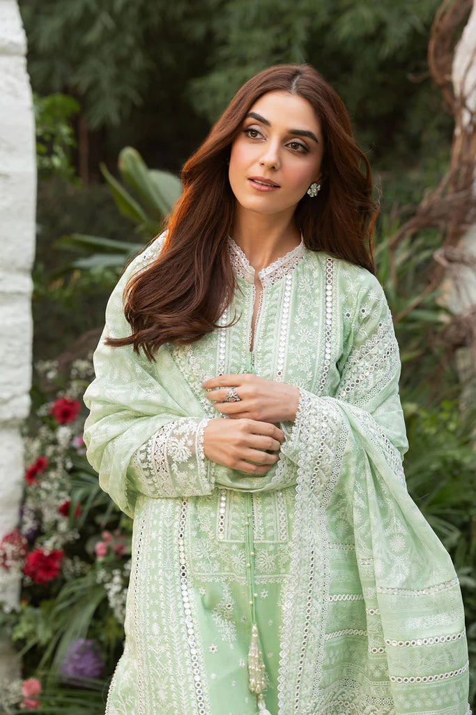 Model wearing Sobia Nazir Design 7B pastel green luxury lawn dress with delicate embroidery. Shop Pakistani clothes online in the UK for casual and festive wear.
