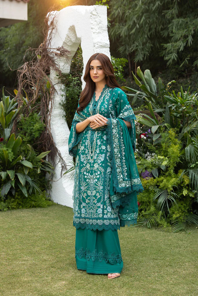 Model wearing Sobia Nazir Design 8B emerald green luxury lawn dress. Shop Pakistani clothes online in the UK for summer casual and festive wear.