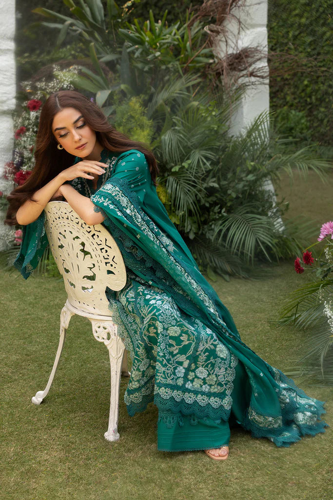 Model wearing Sobia Nazir Design 8B emerald green luxury lawn dress. Shop Pakistani clothes online in the UK for summer casual and festive wear.