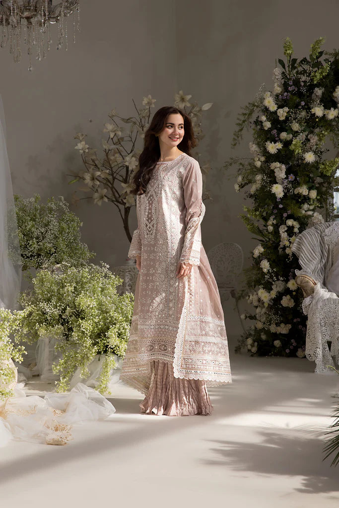 Model wearing Sobia Nazir Design 9A pastel pink luxury lawn dress with delicate embroidery. Shop Pakistani clothes online in the UK for casual and festive wear.