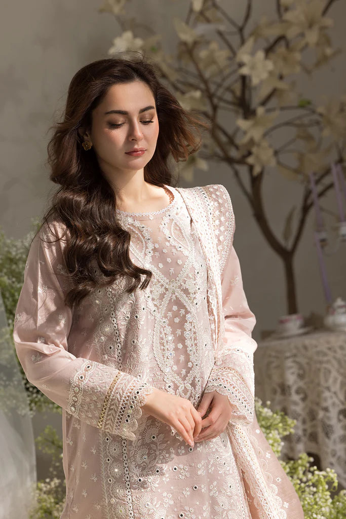 Model wearing Sobia Nazir Design 9A pastel pink luxury lawn dress with delicate embroidery. Shop Pakistani clothes online in the UK for casual and festive wear.