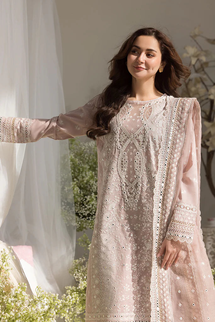 Model wearing Sobia Nazir Design 9A pastel pink luxury lawn dress with delicate embroidery. Shop Pakistani clothes online in the UK for casual and festive wear.