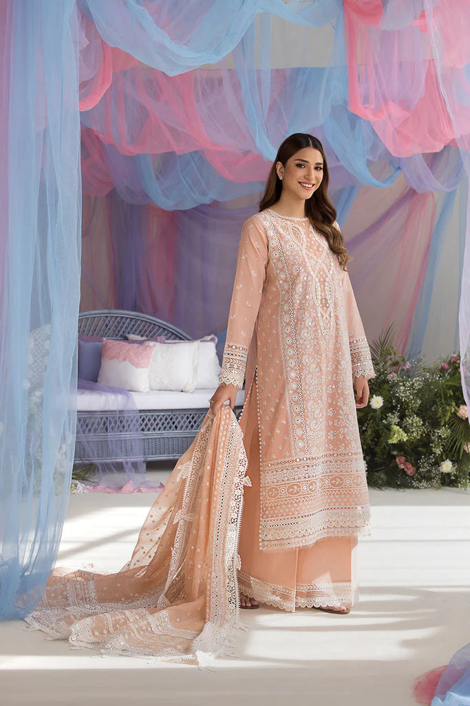 Model wearing Sobia Nazir Design 9B peach luxury lawn dress with delicate embroidery. Shop Pakistani clothes online in the UK for casual and festive wear.