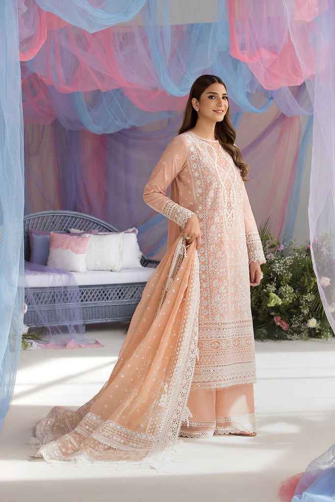 Model wearing Sobia Nazir Design 9B peach luxury lawn dress with delicate embroidery. Shop Pakistani clothes online in the UK for casual and festive wear.