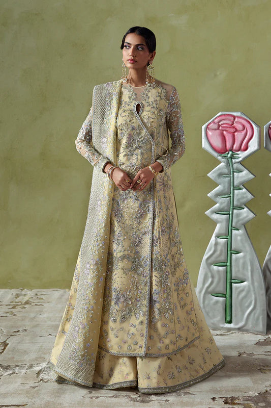 Model wearing Liora by Soraya in soft mustard embellished saree – Pakistani luxury pret ideal for weddings, shop Pakistani clothes online in UK.