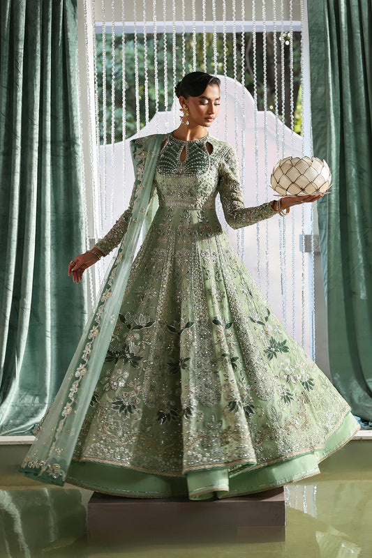 Model wearing Lirien by Soraya in pistachio green with intricate embroidery – Pakistani luxury pret, shop Pakistani clothes online in UK.
