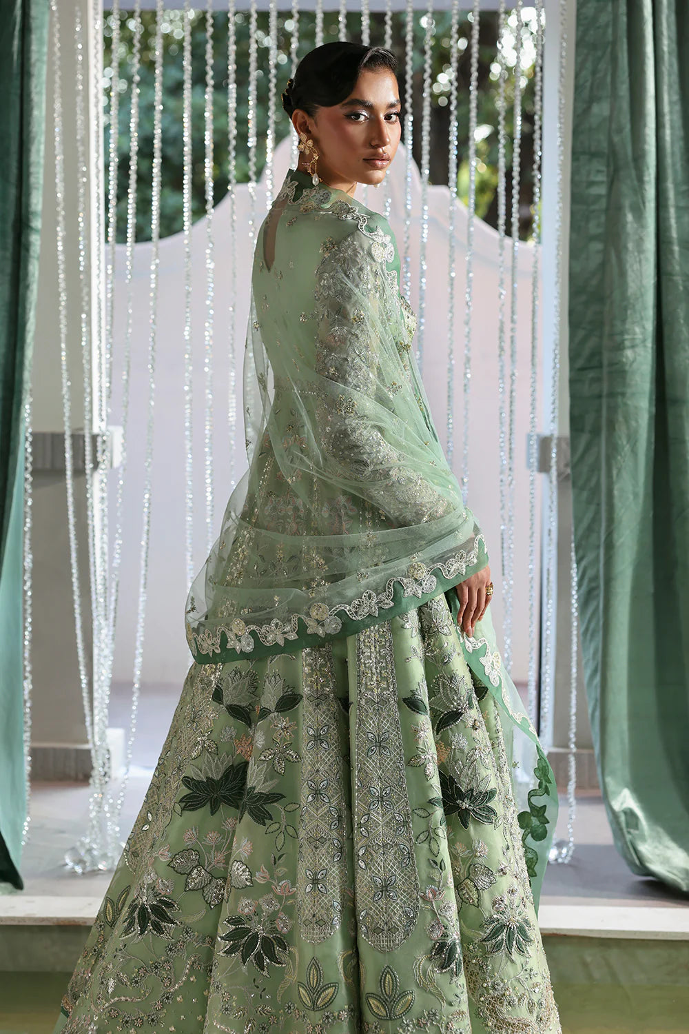 Model wearing Lirien by Soraya in pistachio green with intricate embroidery – Pakistani luxury pret, shop Pakistani clothes online in UK.
