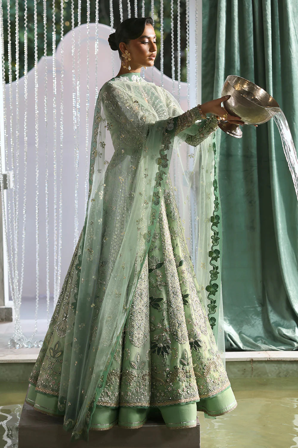 Model wearing Lirien by Soraya in pistachio green with intricate embroidery – Pakistani luxury pret, shop Pakistani clothes online in UK.
