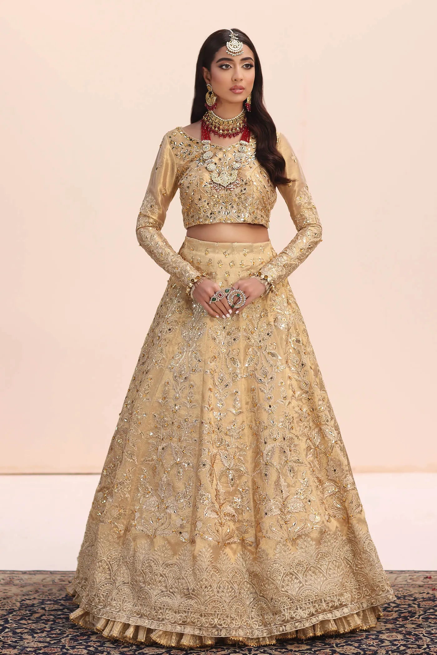 Model in Musferah Saad Luminous Dream gold Pakistani wedding dress, UK.