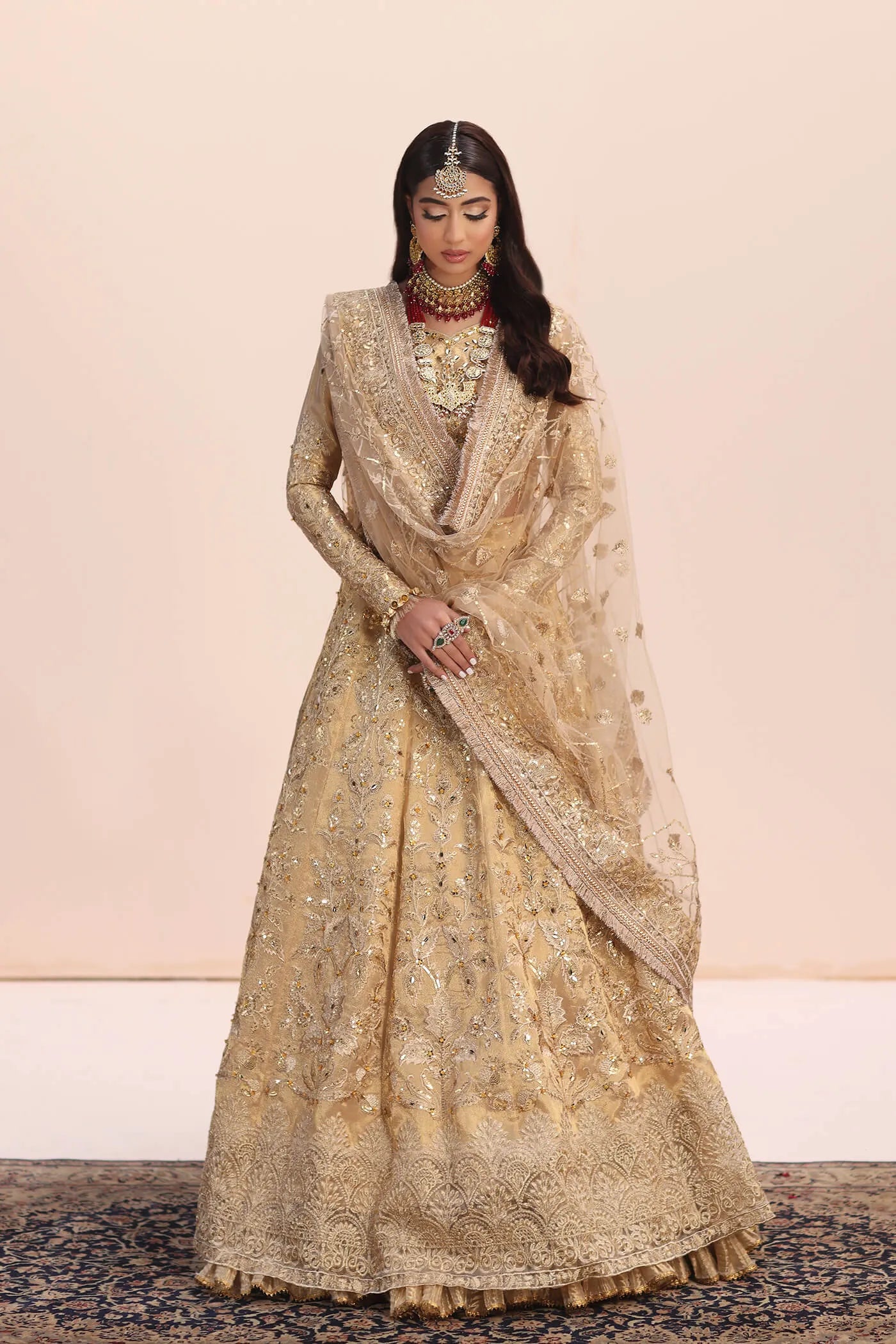 Model in Musferah Saad Luminous Dream gold Pakistani wedding dress, UK.