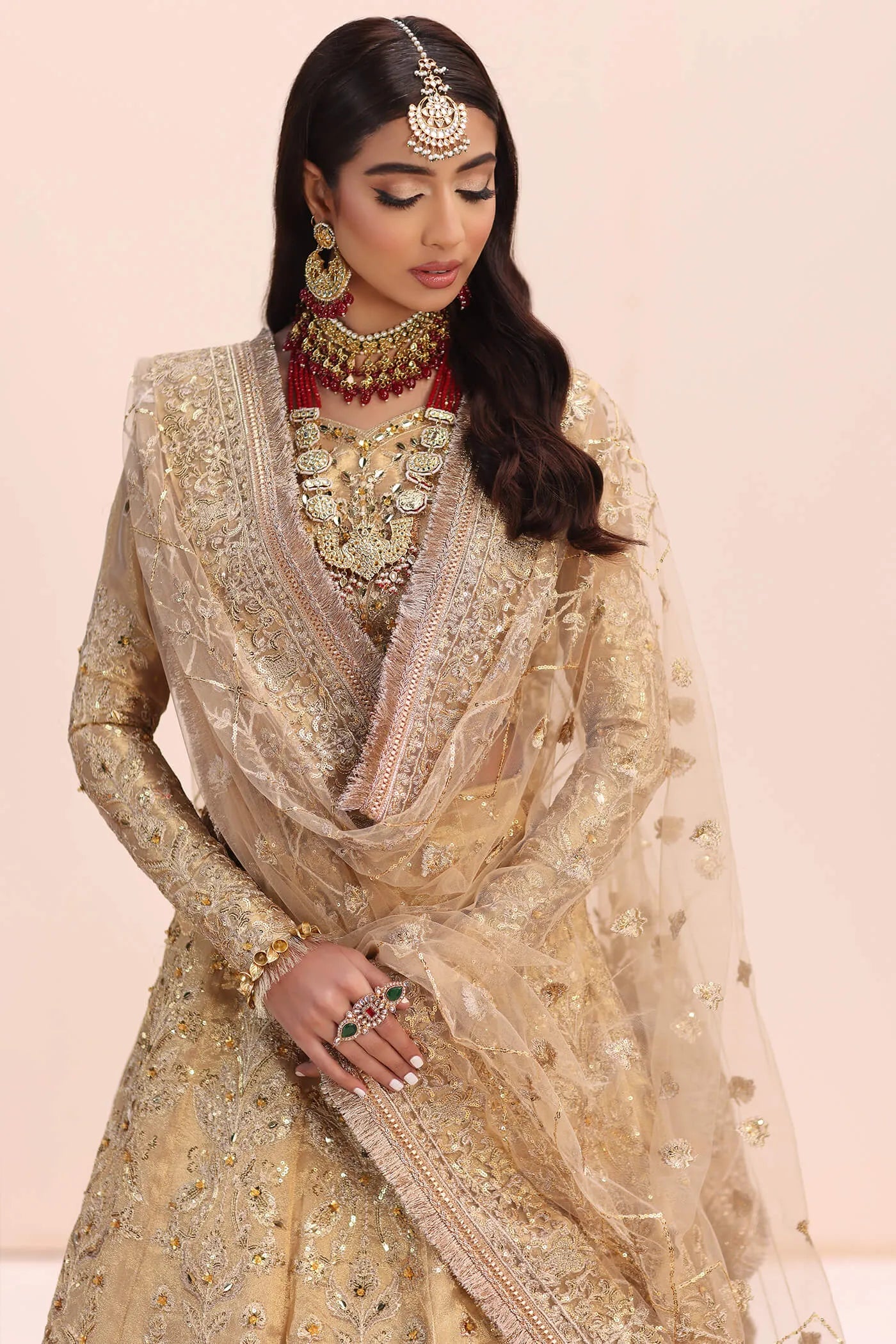 Model in Musferah Saad Luminous Dream gold Pakistani wedding dress, UK.