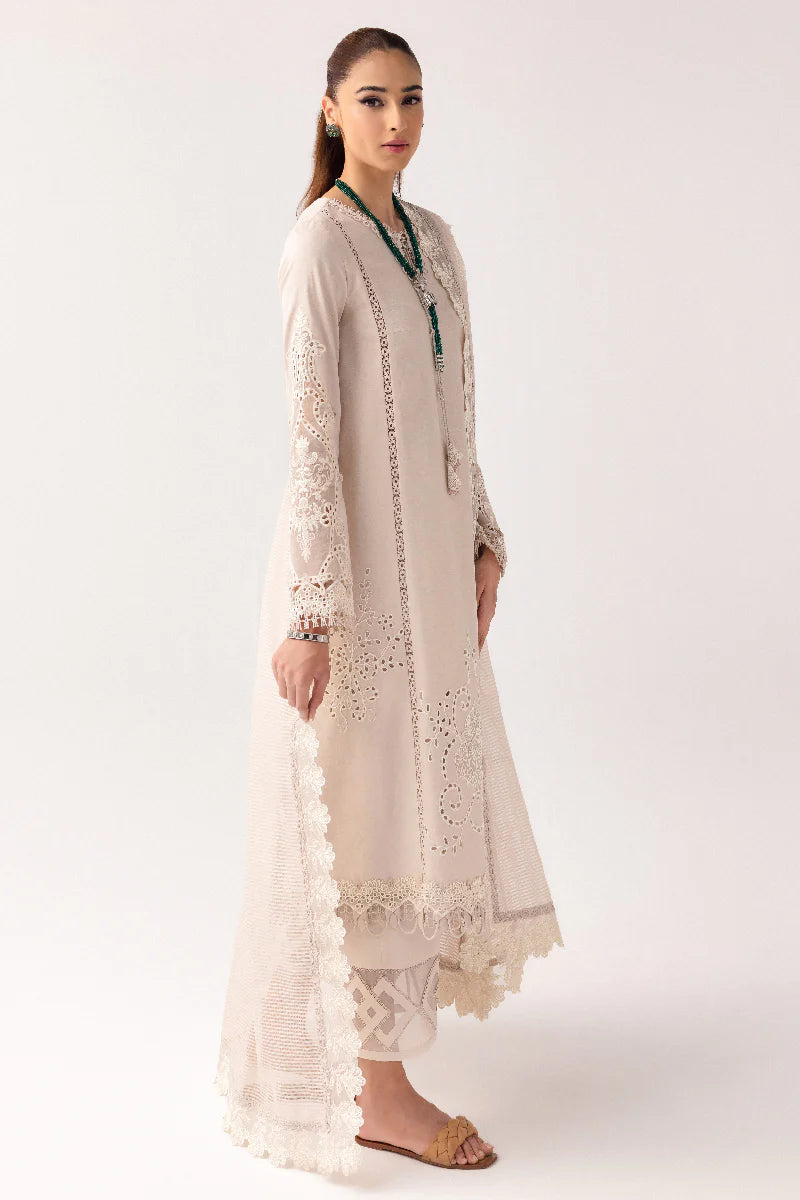 Model wearing ivory embroidered dress from Qalamkar Basic Pret '25 KT-03 Naire, Saffron Pakistani Luxury pret available online in UK.