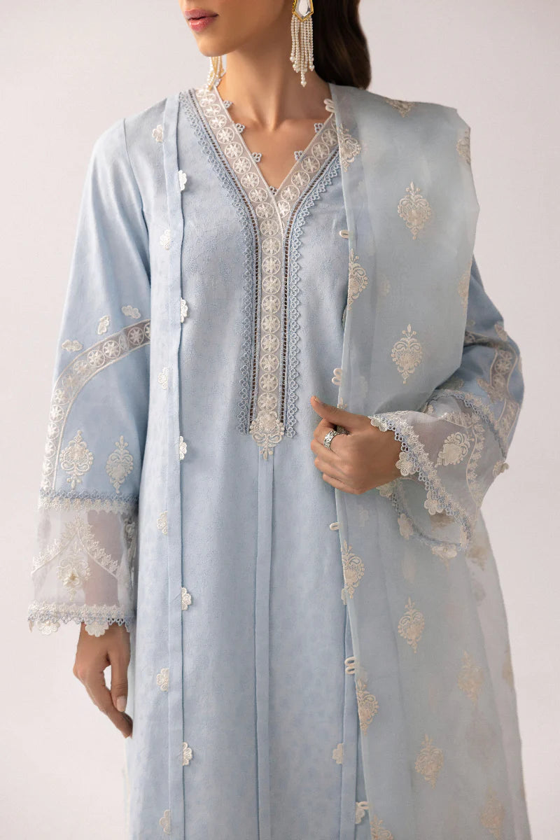 Model wearing powder blue embroidered dress from Qalamkar Basic Pret '25 KT-04 Wardah, Saffron Pakistani Luxury pret online in UK.