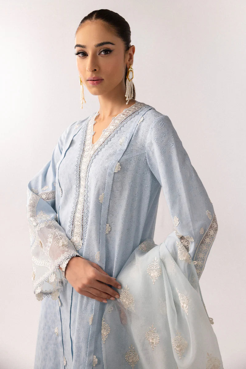 Model wearing powder blue embroidered dress from Qalamkar Basic Pret '25 KT-04 Wardah, Saffron Pakistani Luxury pret online in UK.