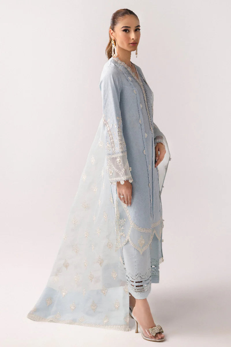 Model wearing powder blue embroidered dress from Qalamkar Basic Pret '25 KT-04 Wardah, Saffron Pakistani Luxury pret online in UK.
