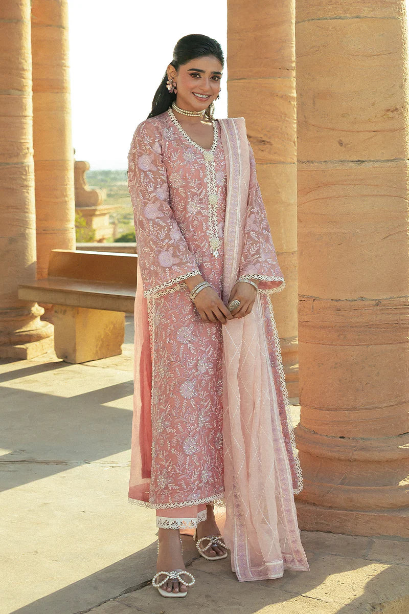 Model wearing Mushq Saugaat City of Lights Areej in soft pink with delicate embroidery and embellishments. Shop Pakistani luxury pret online in the UK.