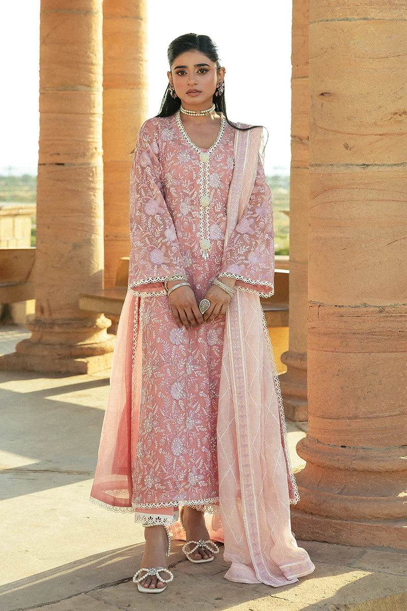 Model wearing Mushq Saugaat City of Lights Areej in soft pink with delicate embroidery and embellishments. Shop Pakistani luxury pret online in the UK.