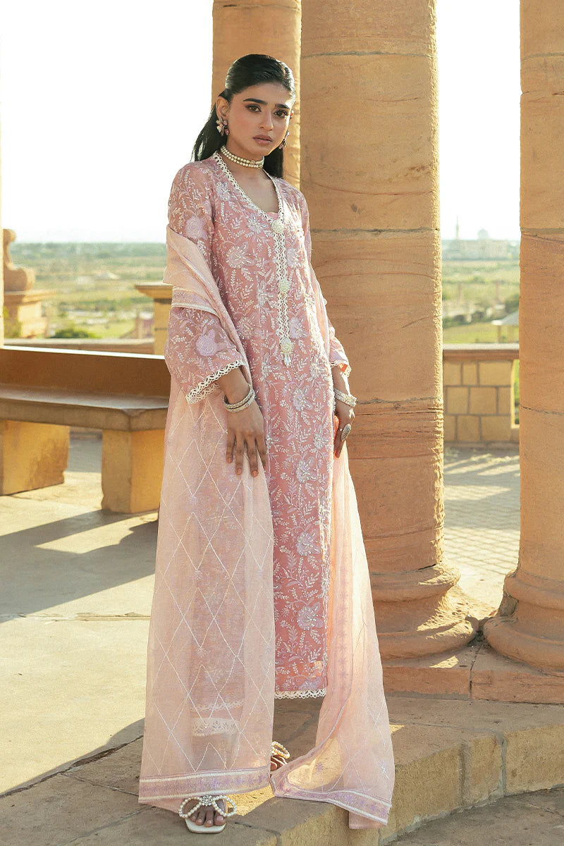 Model wearing Mushq Saugaat City of Lights Areej in soft pink with delicate embroidery and embellishments. Shop Pakistani luxury pret online in the UK.