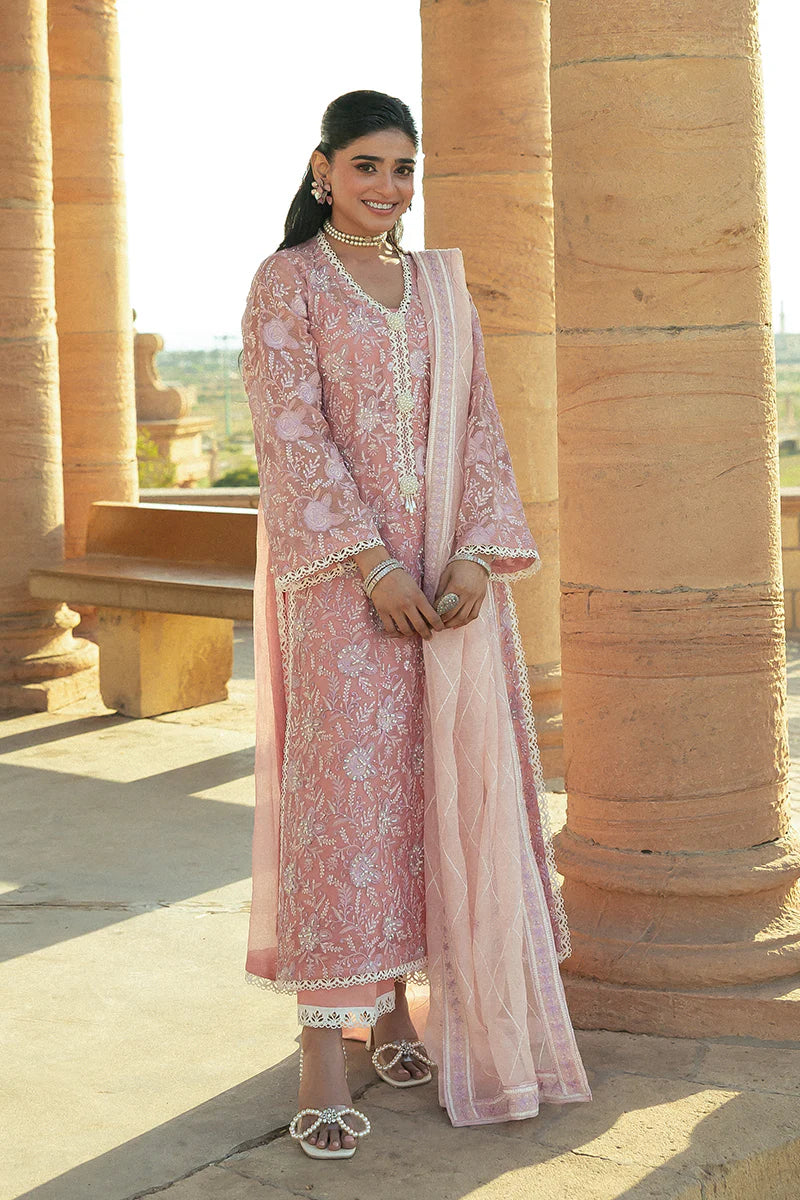 Model wearing Mushq Saugaat City of Lights Areej in soft pink with delicate embroidery and embellishments. Shop Pakistani luxury pret online in the UK.