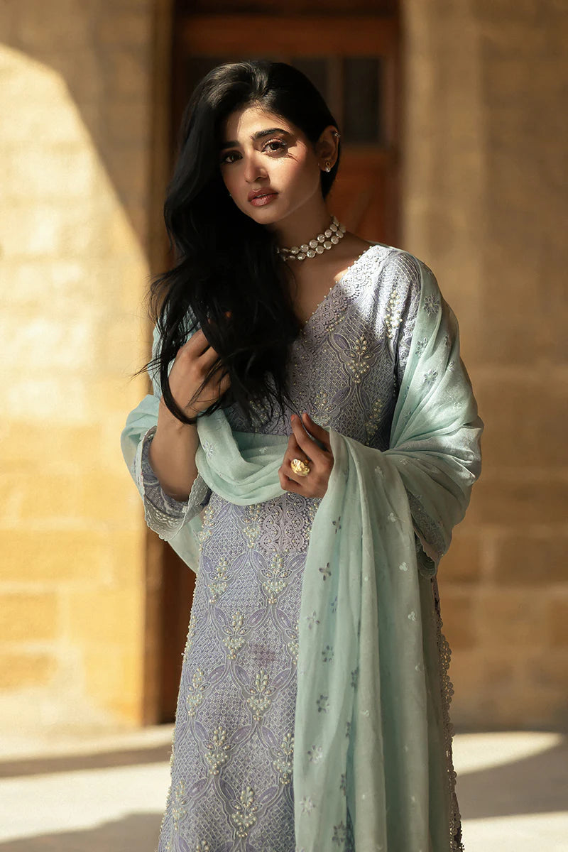 Model wearing Mushq Saugaat City of Lights Mahpara in soft lavender with mint dupatta and lace details. Shop Pakistani luxury pret online in the UK.