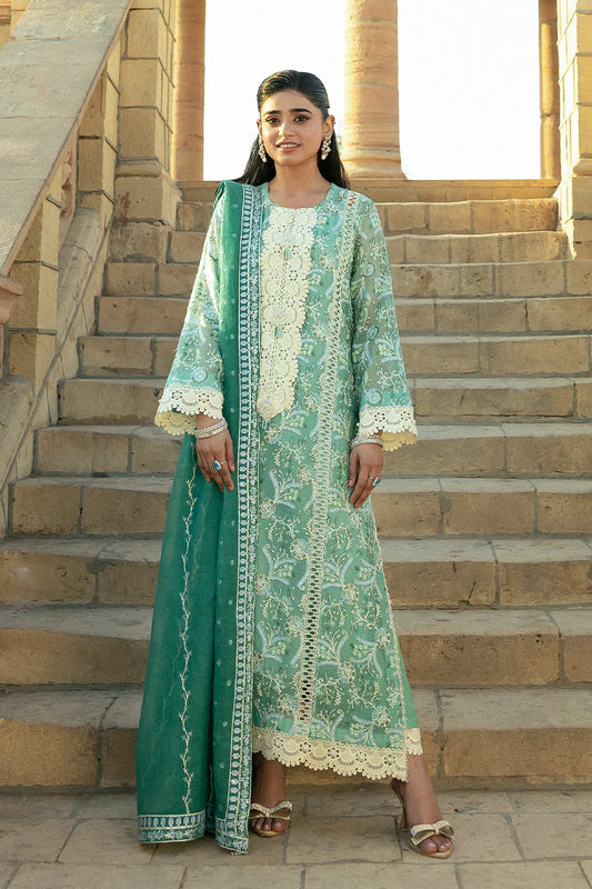 Model wearing Mushq Saugaat City of Lights Irsa in teal green with intricate embroidery. Shop Pakistani luxury pret online in the UK.