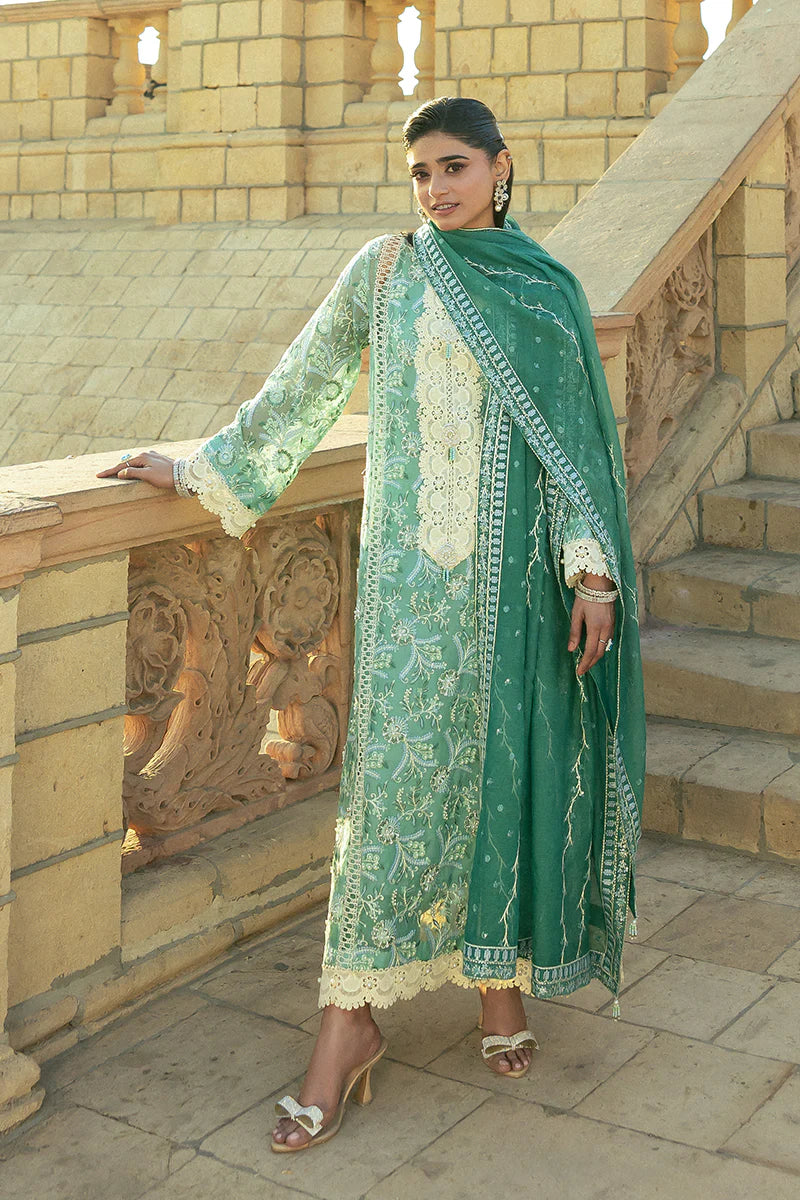 Model wearing Mushq Saugaat City of Lights Irsa in teal green with intricate embroidery. Shop Pakistani luxury pret online in the UK.