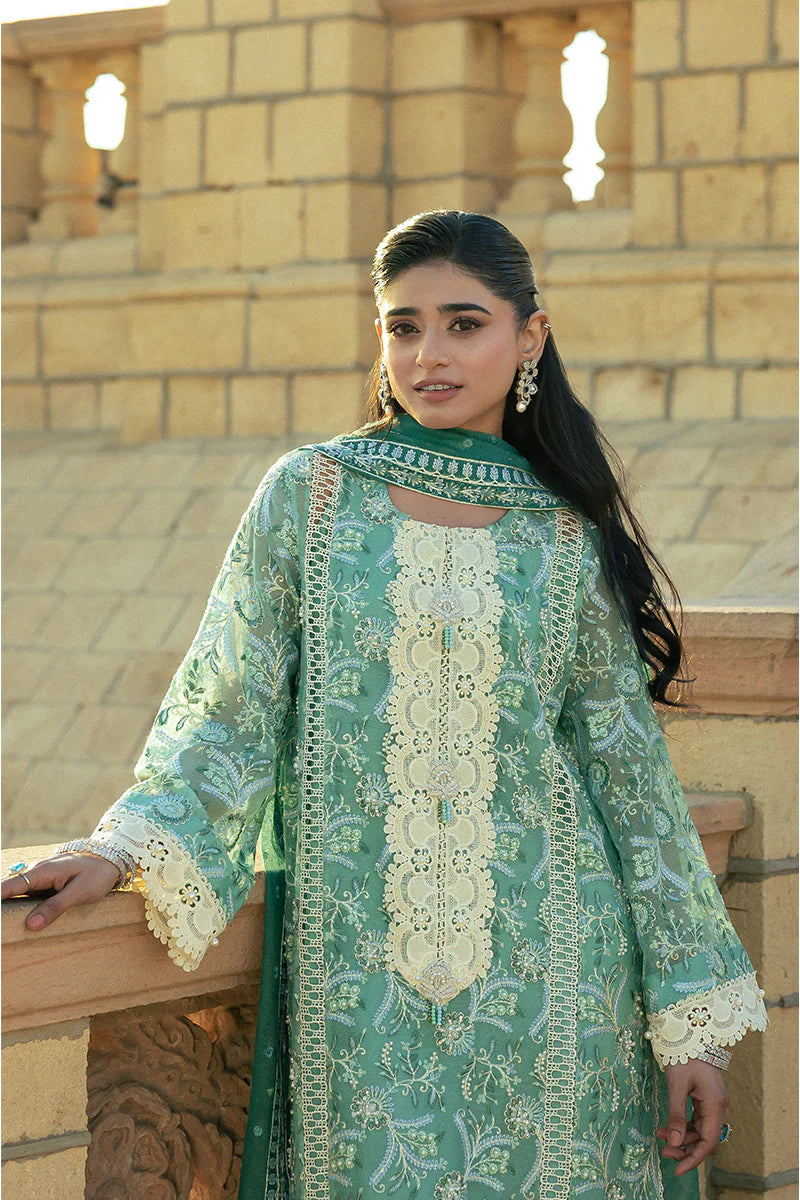 Model wearing Mushq Saugaat City of Lights Irsa in teal green with intricate embroidery. Shop Pakistani luxury pret online in the UK.