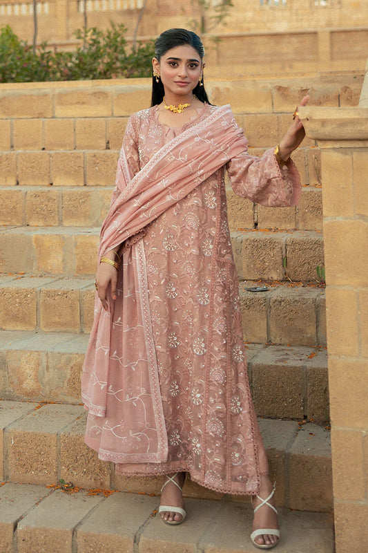 Model wearing Mushq Saugaat City of Lights Rabia in blush pink with delicate embroidery. Shop Pakistani luxury pret online in the UK.