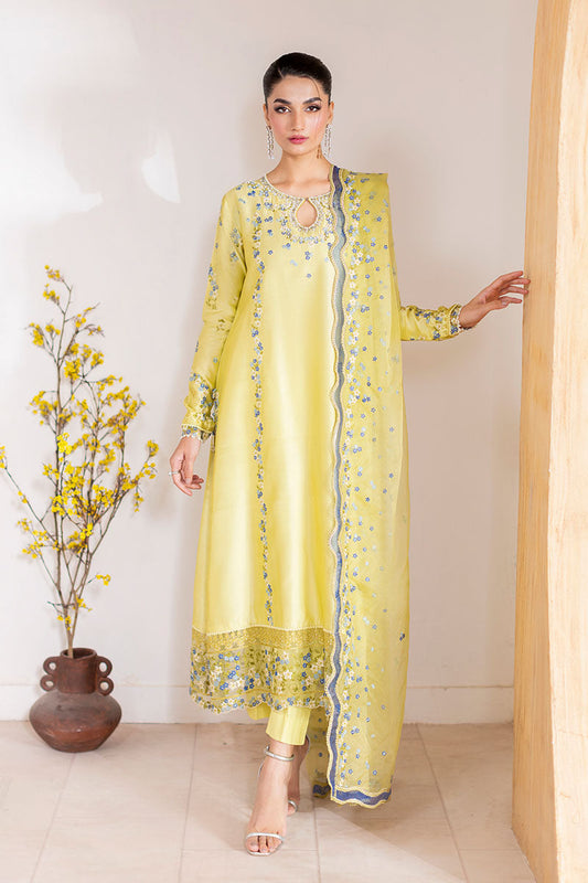 Model wearing lemon yellow Lumiere dress from Mushq with delicate blue embroidery, perfect for Pakistani luxury pret and clothes online in UK.
