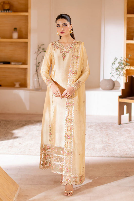 Model wearing golden Aurea dress from Mushq featuring intricate embellishments, ideal for Pakistani luxury pret and clothes online in UK.