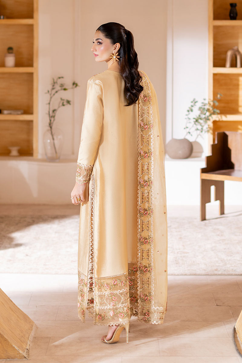 Model wearing golden Aurea dress from Mushq featuring intricate embellishments, ideal for Pakistani luxury pret and clothes online in UK.