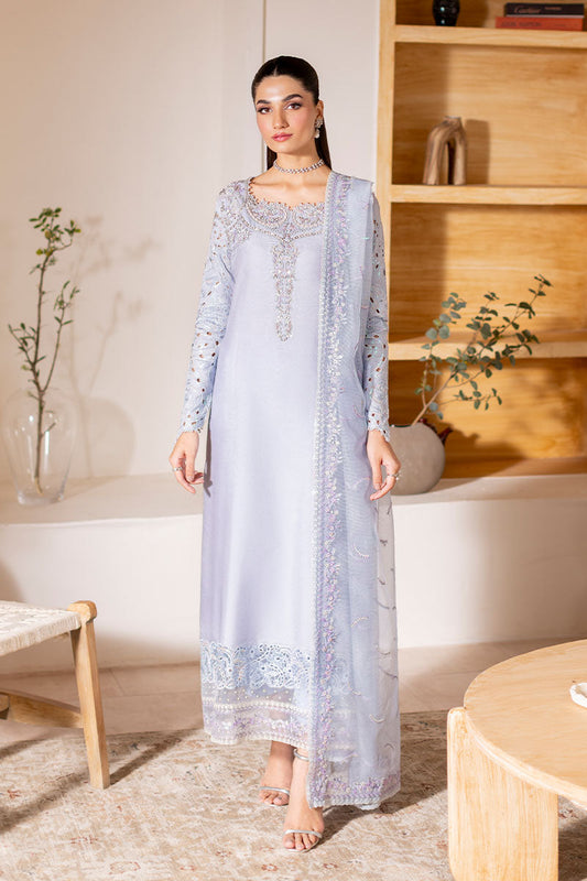 Model wearing ice blue Verve dress from Mushq, showcasing elegant embroidery for Pakistani luxury pret and Pakistani clothes online in UK.