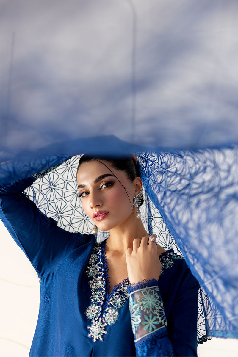 Model wearing deep navy blue embroidered Kayra dress from Mushq, ideal for Pakistani luxury pret and Pakistani clothes online in UK.
