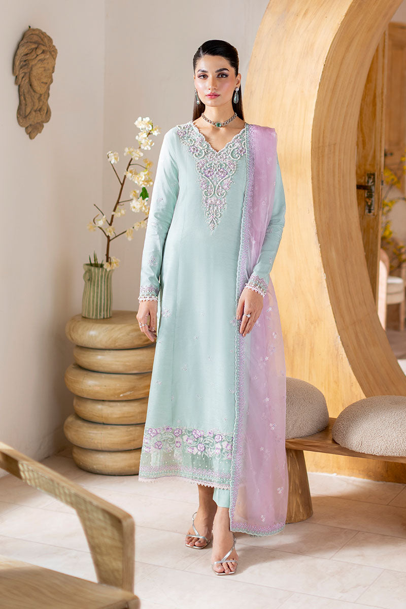 Model wearing mint green and lilac embroidered outfit Solstice from Mushq, showcasing Pakistani luxury pret and clothes online in UK.
