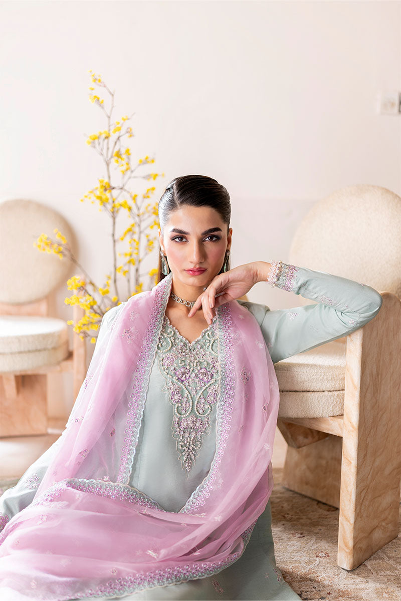 Model wearing mint green and lilac embroidered outfit Solstice from Mushq, showcasing Pakistani luxury pret and clothes online in UK.
