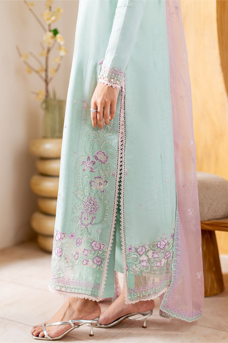 Model wearing mint green and lilac embroidered outfit Solstice from Mushq, showcasing Pakistani luxury pret and clothes online in UK.
