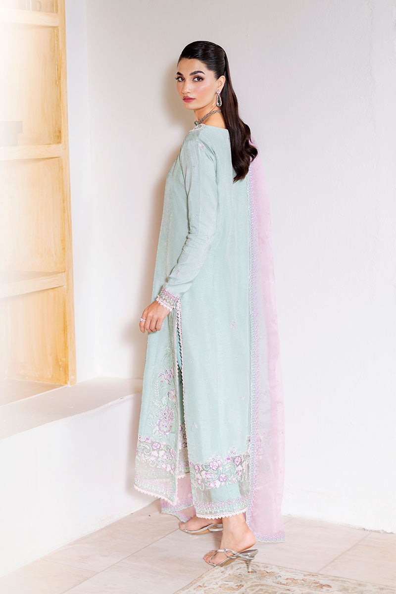 Model wearing mint green and lilac embroidered outfit Solstice from Mushq, showcasing Pakistani luxury pret and clothes online in UK.

