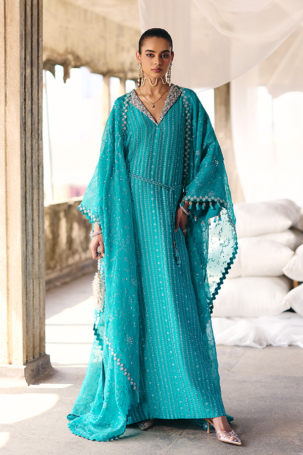 Model wearing NAIDA, side angle, a Pakistani designer outfit by Suffuse, available online in the UK.