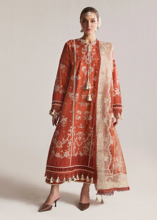 Model wearing orange Sienna dress from Hussain Rehar, SS Lawn Eid Collection '24. Pakistani designer clothes in UK, readymade clothes, stylish and elegant.