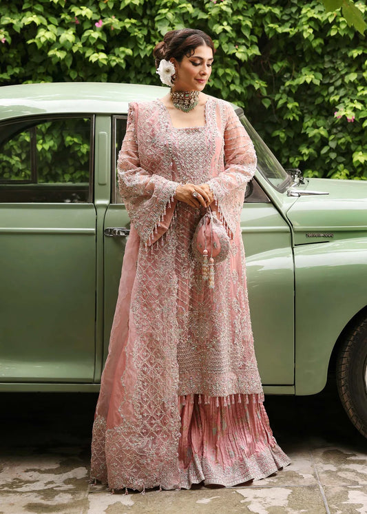 Model wearing Huriya by Kanwal Malik in black heavily embroidered outfit – Pakistani luxury pret available online in UK for festive wear.