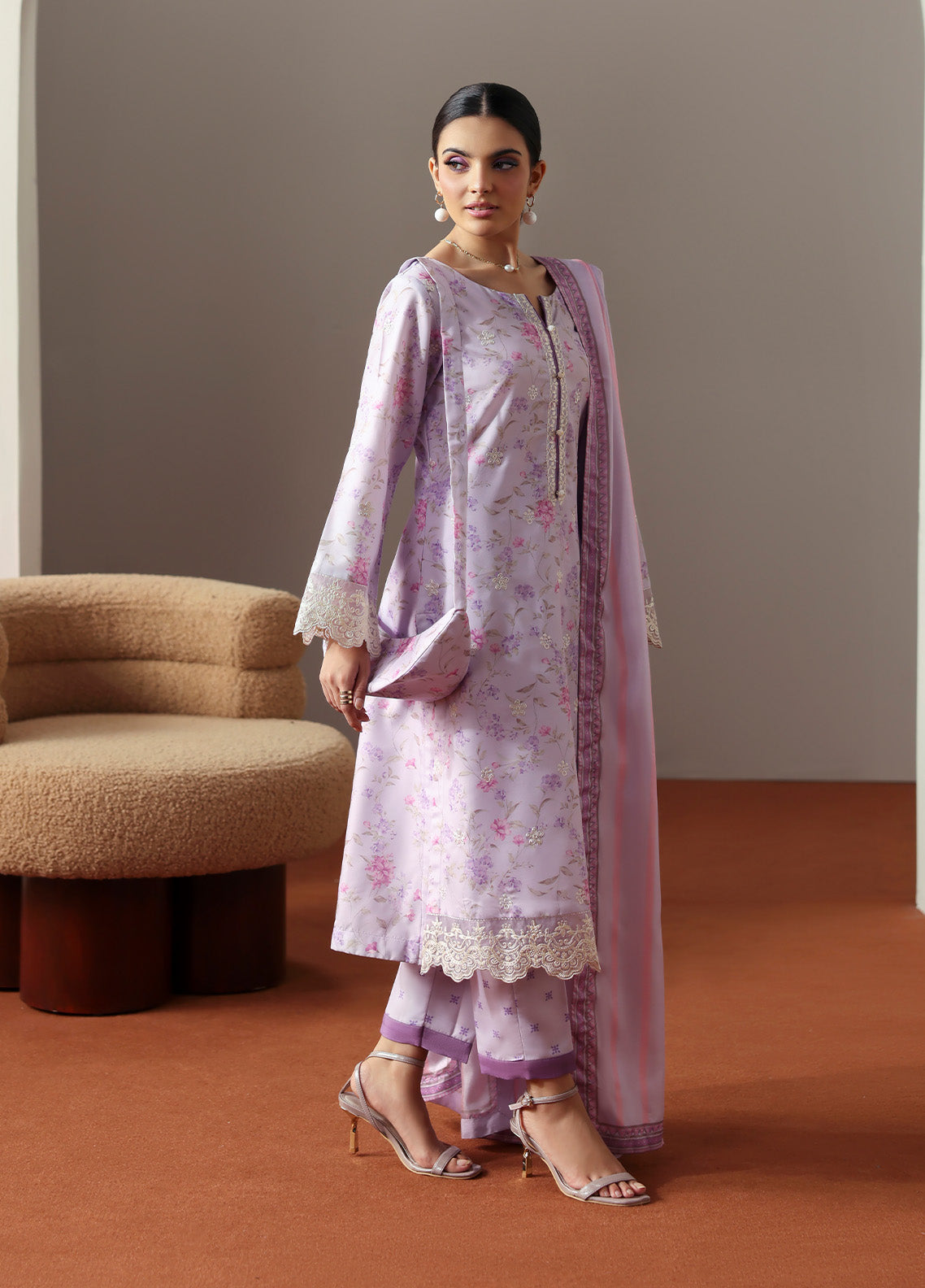 Model wearing Quince from Gulaal in a soft lavender printed co-ord set with lace detailing and striped dupatta, perfect for Pakistani luxury pret in the UK.
