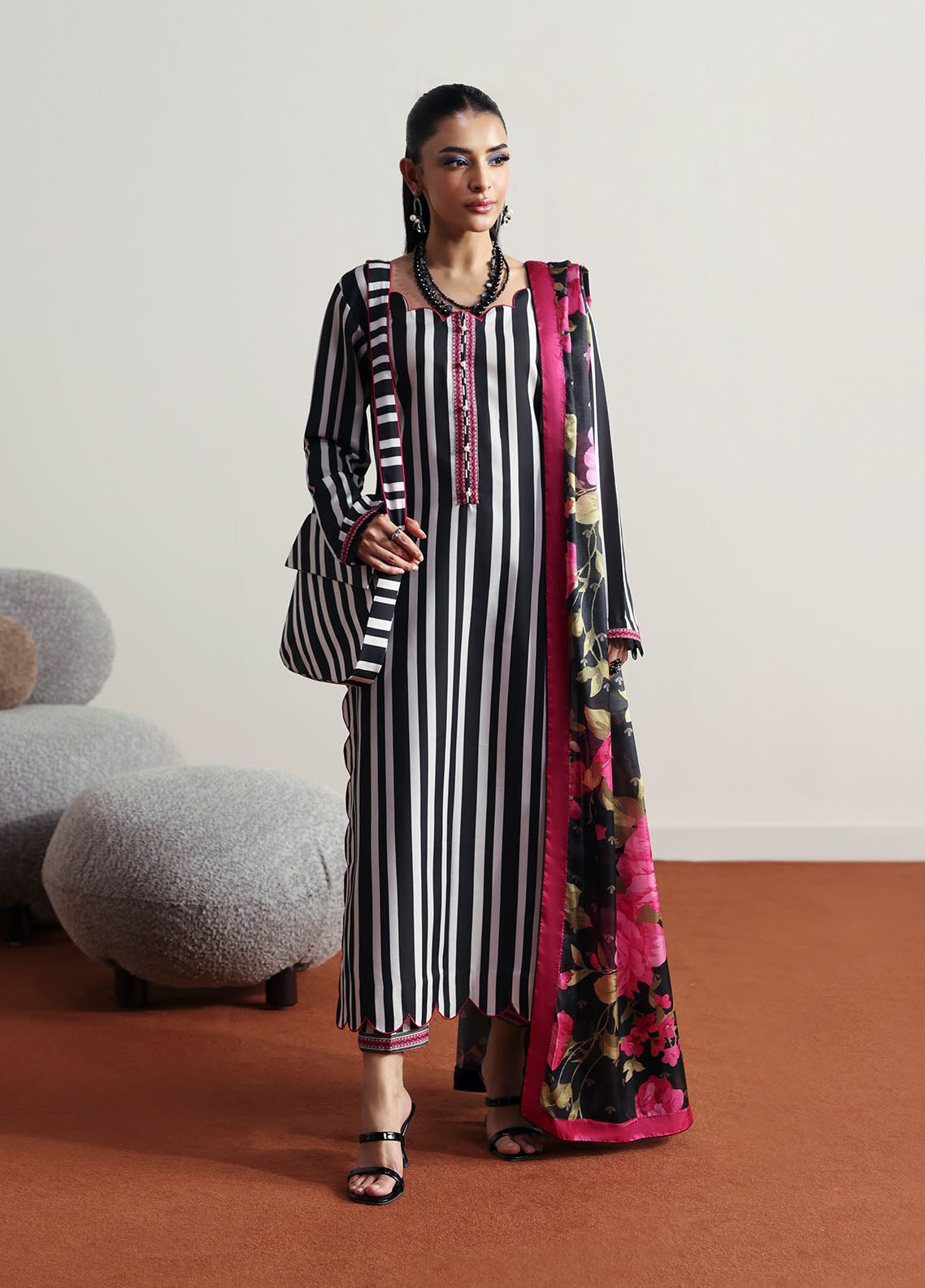 Model wearing black and white striped outfit with floral dupatta from Gulaal Basics | Fleuron, ideal Pakistani luxury pret in UK.