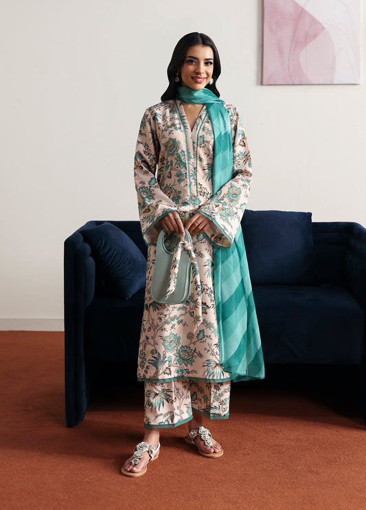 Model wearing meadowe from Gulaal in a beige printed co-ord set with teal floral design and matching dupatta, ideal for Pakistani luxury pret in the UK.