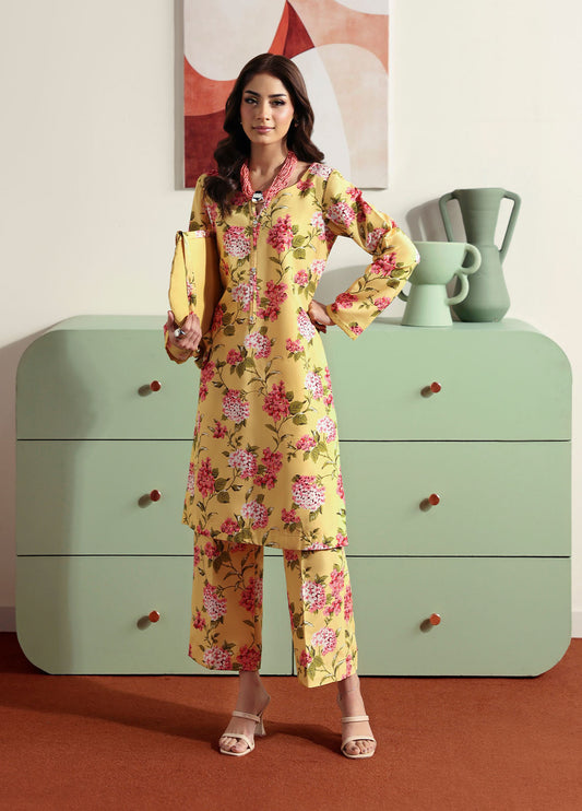 Model wearing yellow floral printed outfit from Gulaal Basics | Honey Dew, Pakistani luxury pret ideal for Pakistani clothes online in UK.