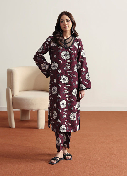 Model wearing Evra from Gulaal in a deep maroon printed co-ord set with bold white floral patterns, perfect for Pakistani luxury pret in the UK.
