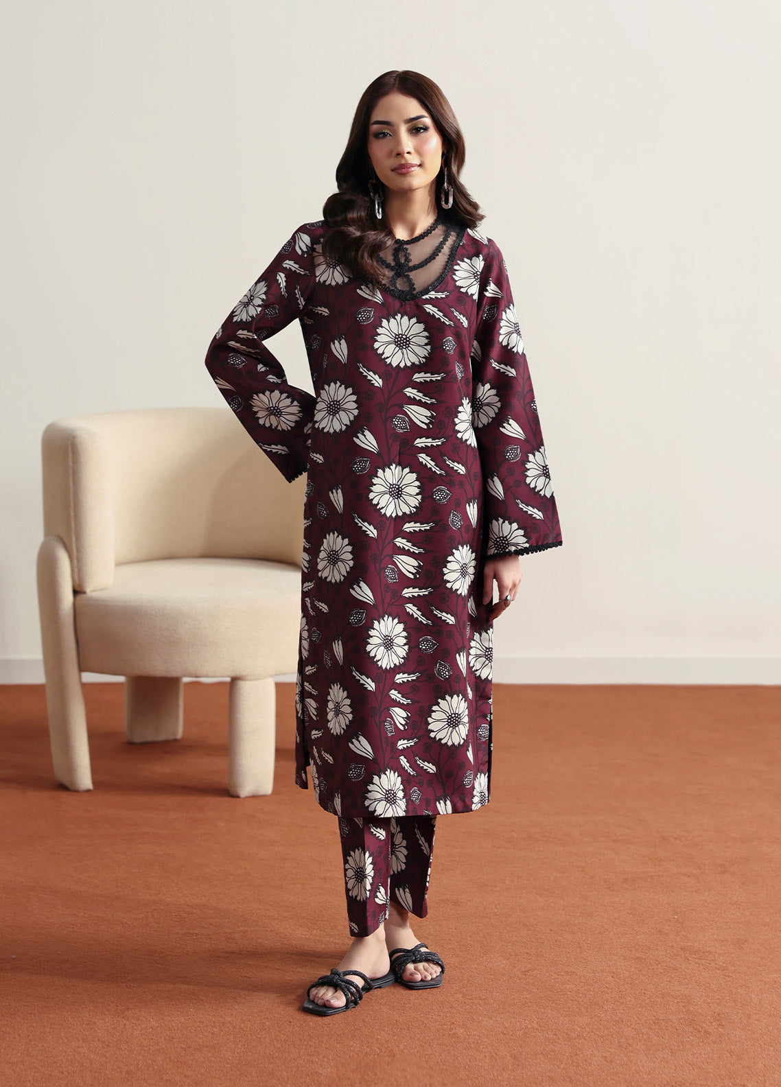 Model wearing Evra from Gulaal in a deep maroon printed co-ord set with bold white floral patterns, perfect for Pakistani luxury pret in the UK.