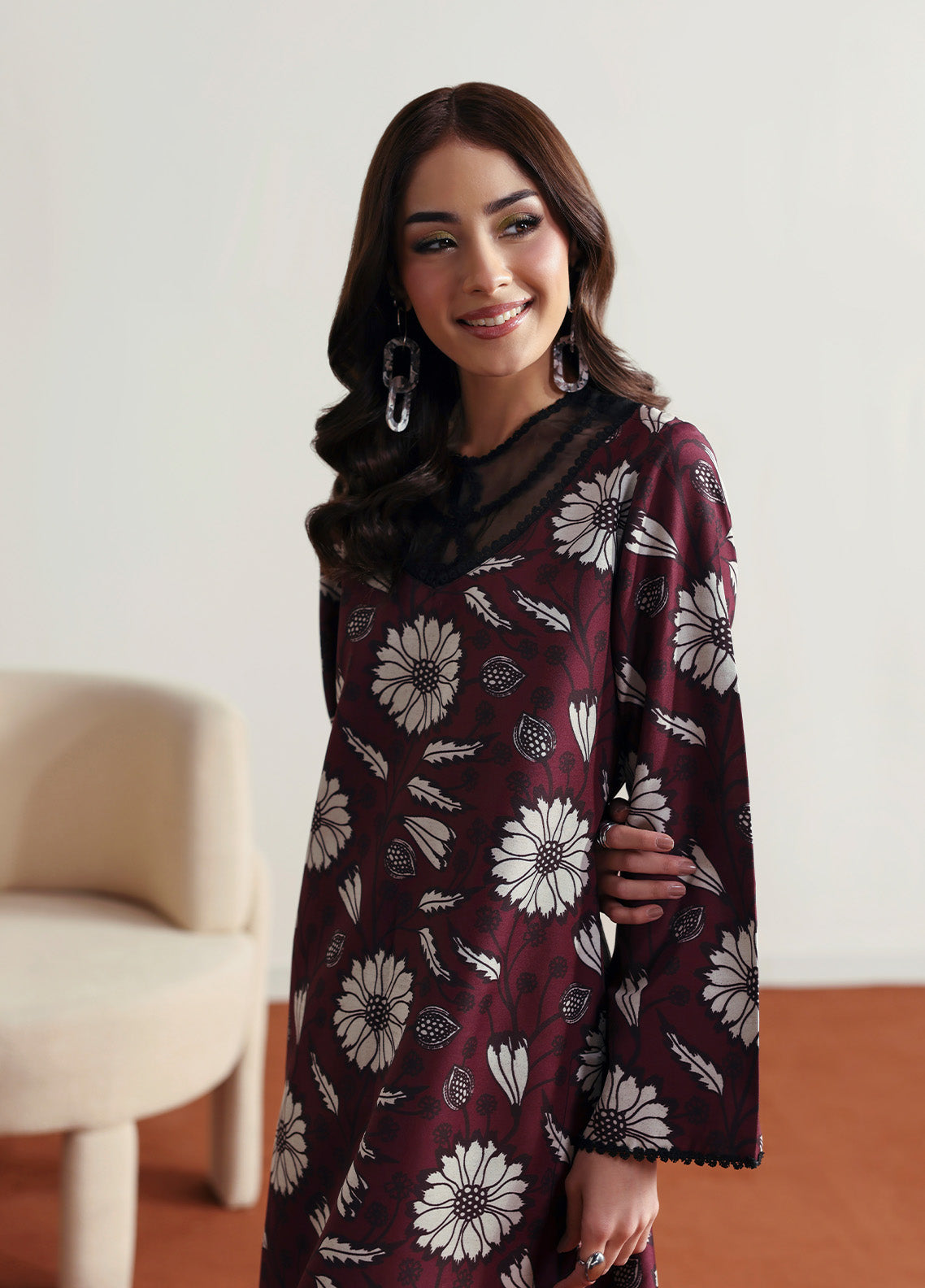 Model wearing Evra from Gulaal in a deep maroon printed co-ord set with bold white floral patterns, perfect for Pakistani luxury pret in the UK.