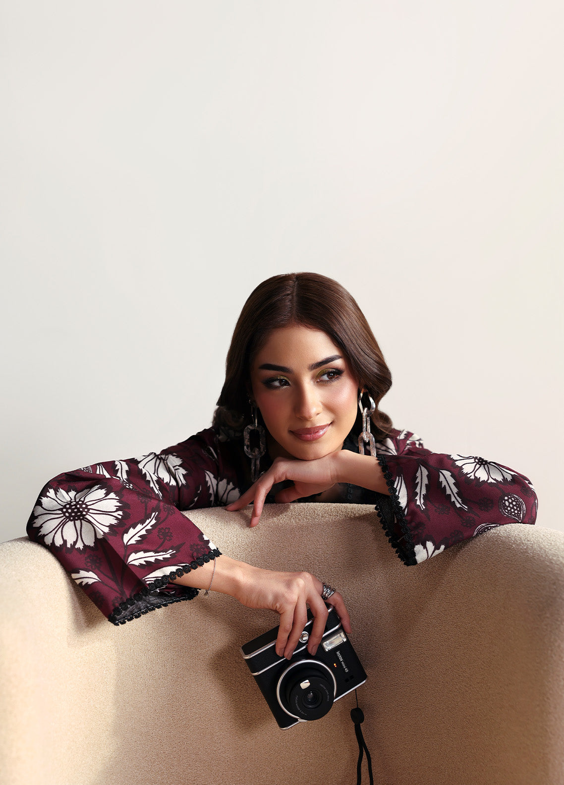 Model wearing Evra from Gulaal in a deep maroon printed co-ord set with bold white floral patterns, perfect for Pakistani luxury pret in the UK.